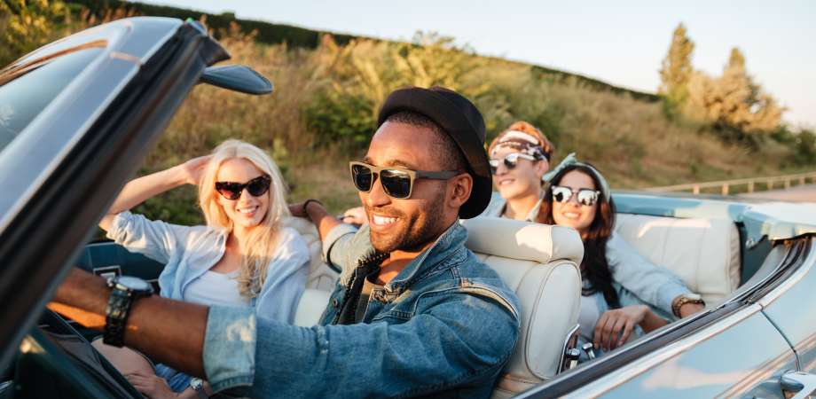 young adults in convertible car